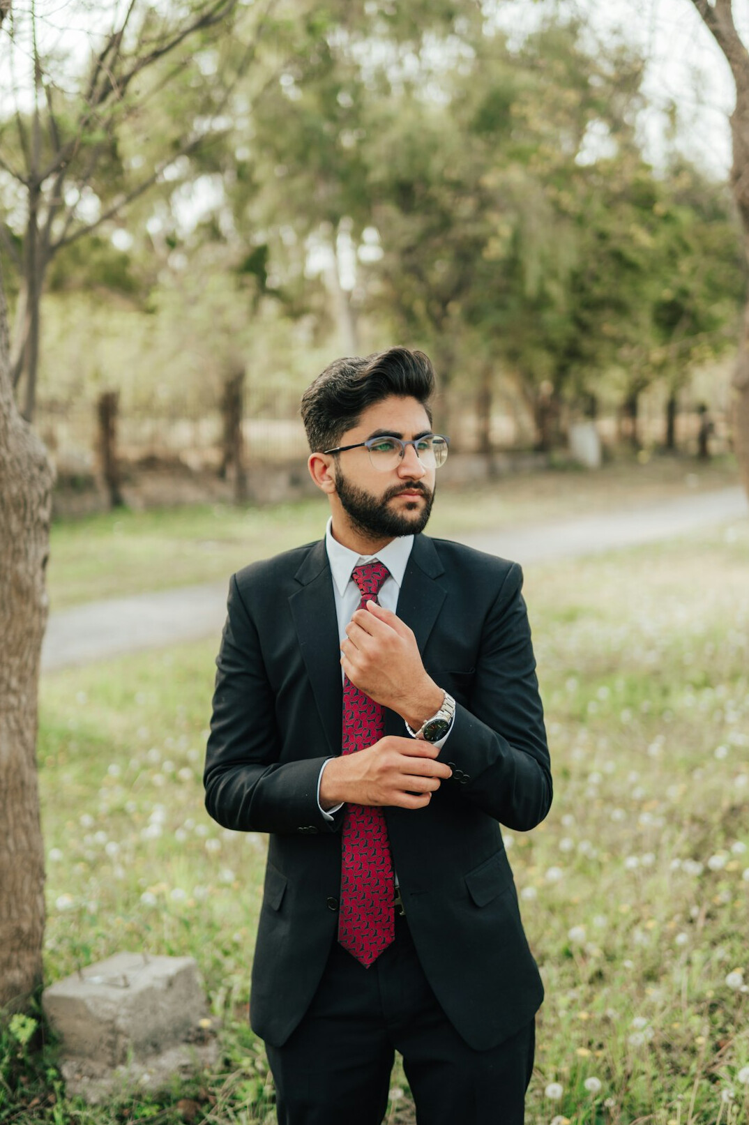 Male executive with dark hair in a suit and tie
