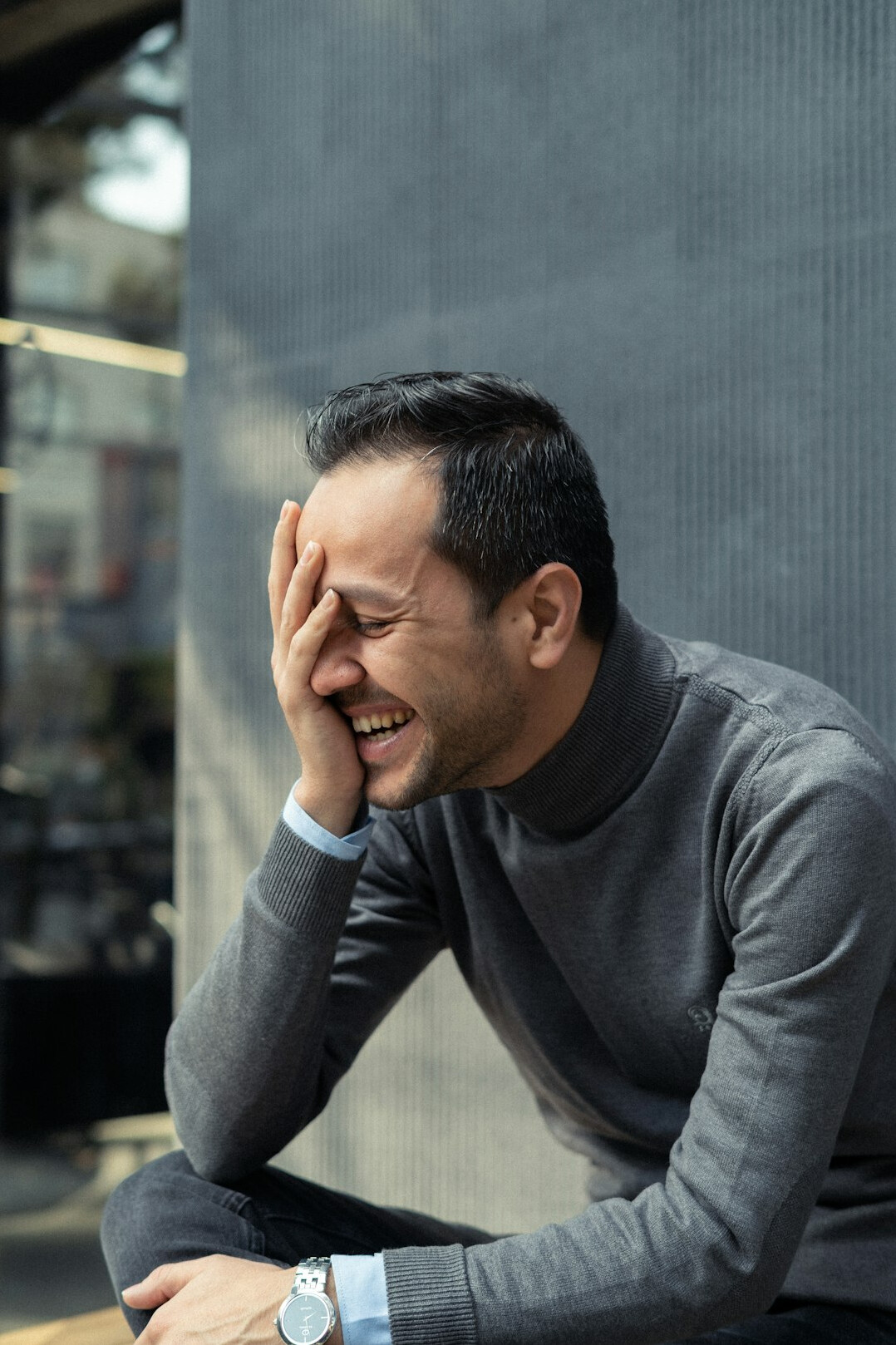 Middle aged businessman with glasses laughing